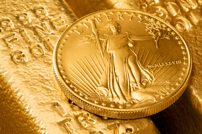 Goldbarren und Münze